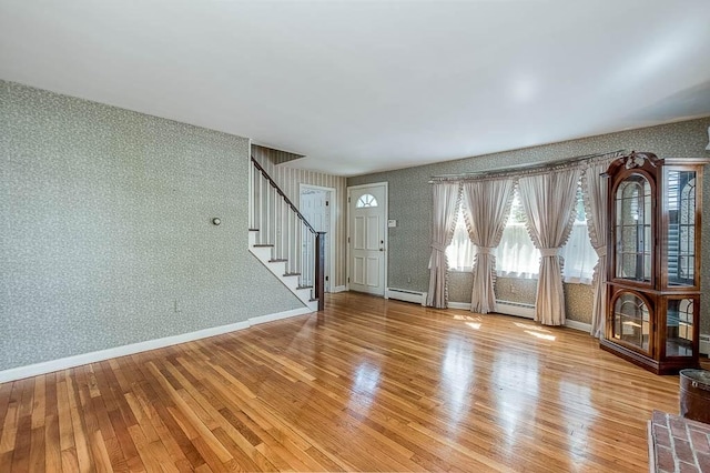16 Miriam Dr, Attleboro, MA 02703 - entrance foyer featuring wallpapered walls, stairway, light wood-style floors, a baseboard heating unit, and baseboards