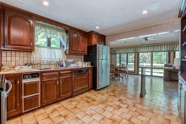 16 Miriam Dr, Attleboro, MA 02703 - kitchen featuring freestanding refrigerator, dishwasher, a ceiling fan, decorative backsplash, and a sink