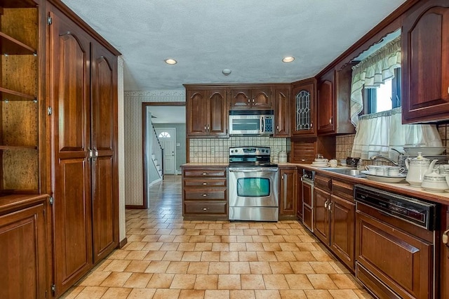 16 Miriam Dr, Attleboro, MA 02703 - kitchen featuring appliances with stainless steel finishes, a sink, tasteful backsplash, recessed lighting, and baseboards