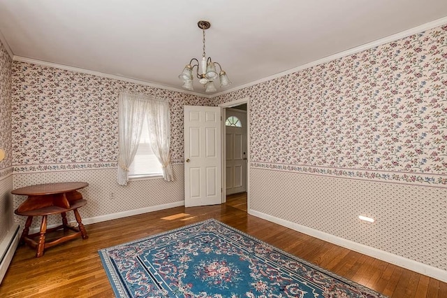 16 Miriam Dr, Attleboro, MA 02703 - dining space featuring wallpapered walls, a chandelier, ornamental molding, hardwood / wood-style floors, and baseboards