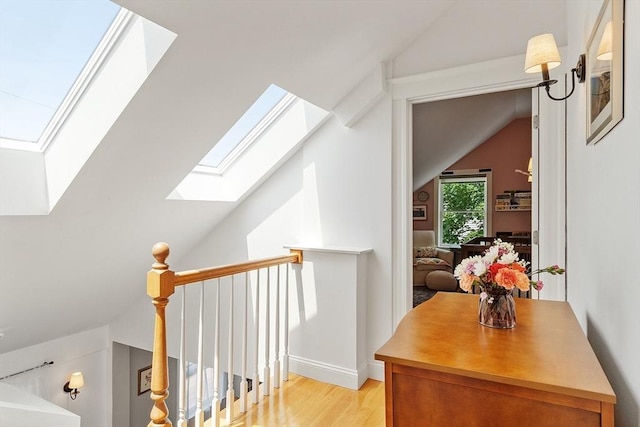 15 Hardy St Unit 2, Salem, MA 01970 - corridor featuring a skylight, vaulted ceiling, and light wood-type flooring