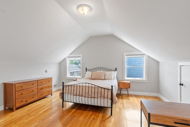 15 Hardy St Unit 2, Salem, MA 01970 - bedroom with light wood-type flooring, vaulted ceiling, and baseboards