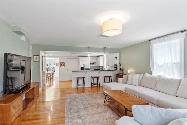 15 Hardy St Unit 2, Salem, MA 01970 - living room with plenty of natural light and light wood finished floors