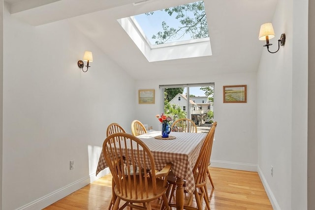 15 Hardy St Unit 2, Salem, MA 01970 - dining space featuring a skylight, light wood-type flooring, and baseboards