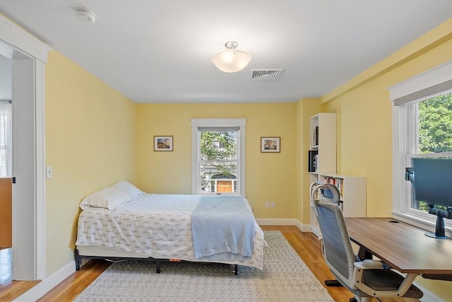 15 Hardy St Unit 2, Salem, MA 01970 - bedroom featuring multiple windows, light wood-style flooring, and baseboards
