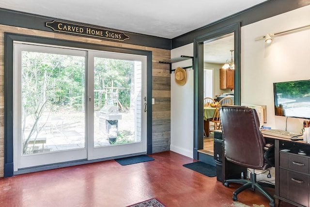 office space featuring wood walls