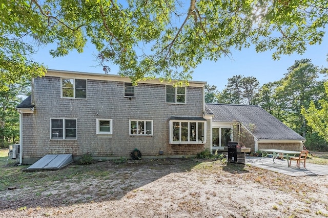 rear view of house featuring a patio