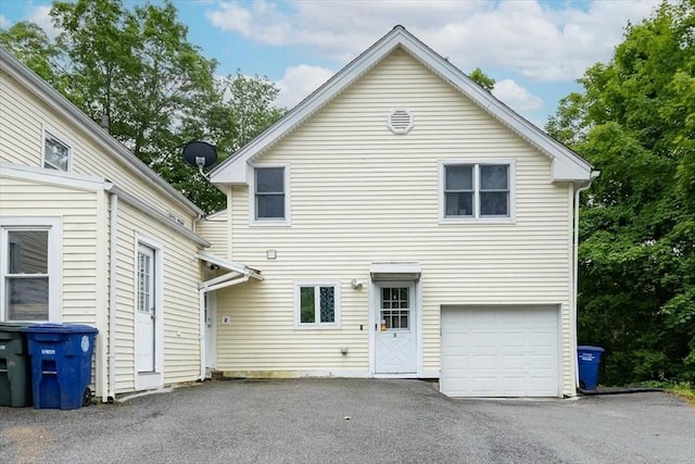66 Hamilton St Unit 3, Leominster, MA 01453 - rear view of property featuring driveway and a garage