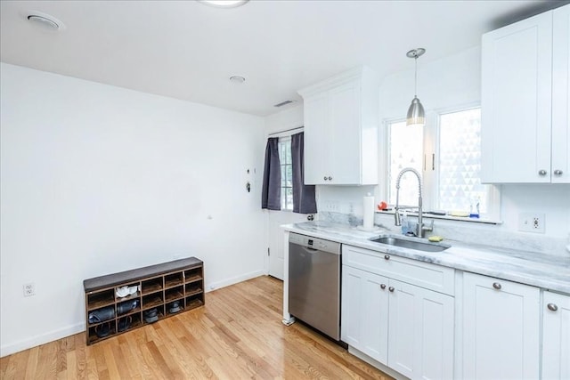 66 Hamilton St Unit 3, Leominster, MA 01453 - kitchen with dishwasher, a sink, light wood-style flooring, white cabinets, and baseboards