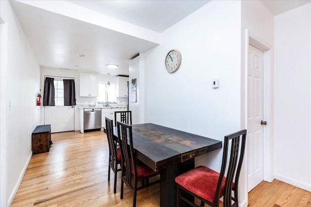 66 Hamilton St Unit 3, Leominster, MA 01453 - dining room with light wood-type flooring and baseboards