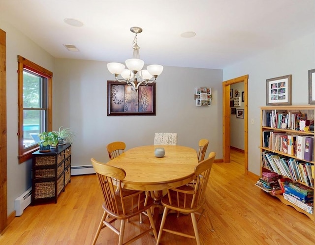 131 Sandgully Rd N, Deerfield, MA 01373 - dining space featuring light wood finished floors, a chandelier, a baseboard heating unit, and baseboards