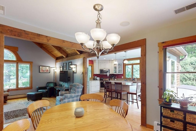 131 Sandgully Rd N, Deerfield, MA 01373 - dining area with baseboard heating, a chandelier, a baseboard radiator, and light wood finished floors