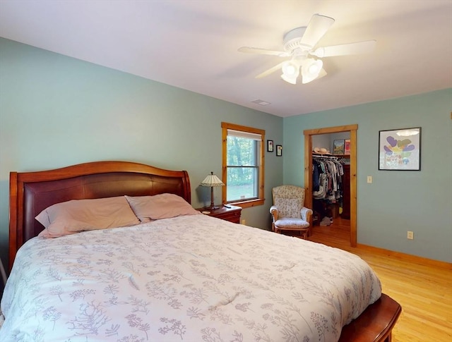 131 Sandgully Rd N, Deerfield, MA 01373 - bedroom featuring wood finished floors, a spacious closet, ceiling fan, and a closet