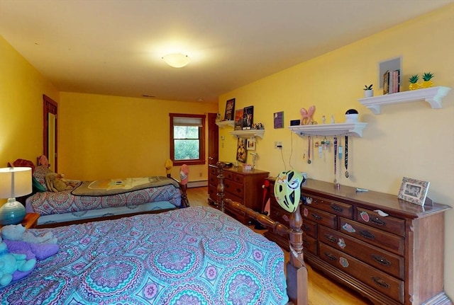 131 Sandgully Rd N, Deerfield, MA 01373 - bedroom with wood finished floors and a baseboard radiator