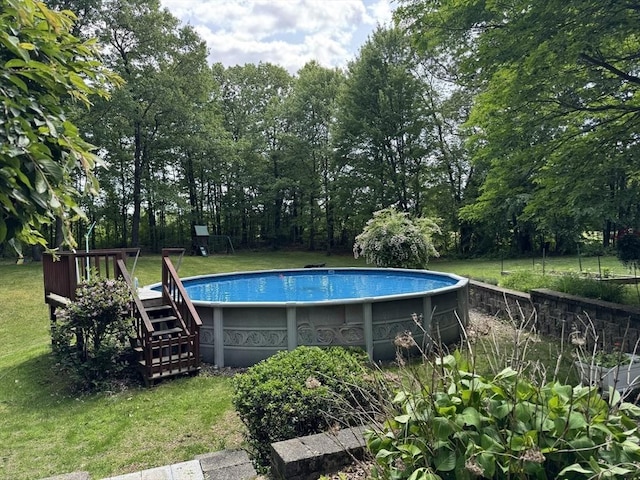 131 Sandgully Rd N, Deerfield, MA 01373 - swimming pool featuring a lawn and view of scattered trees