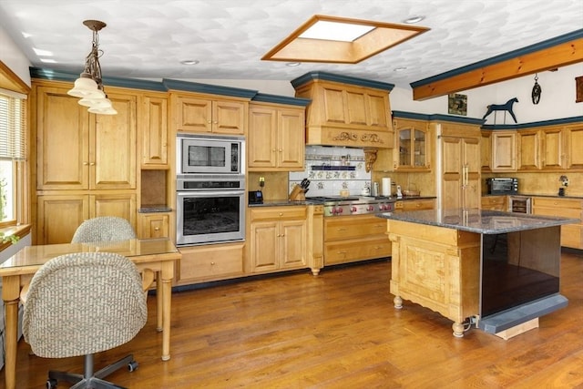 78 Daniels St, Franklin, MA 02038 - kitchen with appliances with stainless steel finishes, decorative backsplash, wood finished floors, decorative light fixtures, and recessed lighting