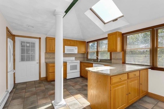 78 Daniels St, Franklin, MA 02038 - kitchen featuring white appliances, a baseboard heating unit, a skylight, backsplash, and a peninsula