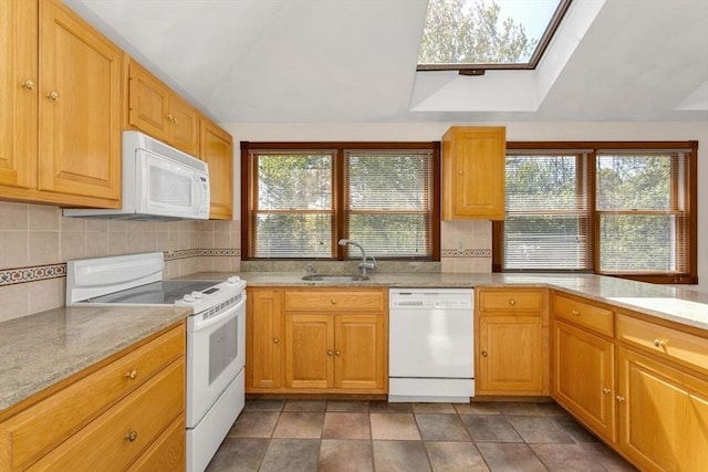 78 Daniels St, Franklin, MA 02038 - kitchen featuring white appliances, a sink, a skylight, tasteful backsplash, and healthy amount of natural light