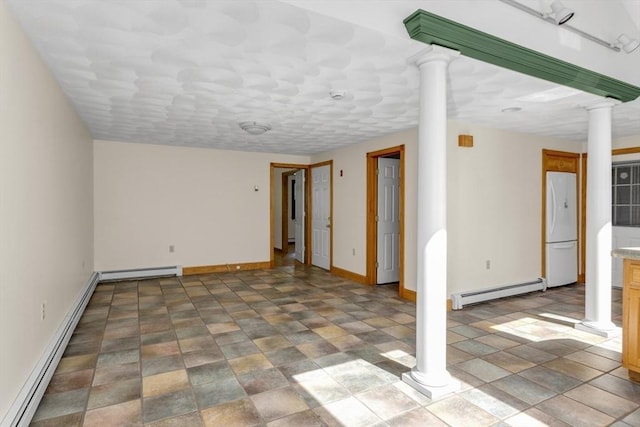 78 Daniels St, Franklin, MA 02038 - basement with baseboard heating, freestanding refrigerator, a baseboard radiator, baseboards, and a baseboard heating unit