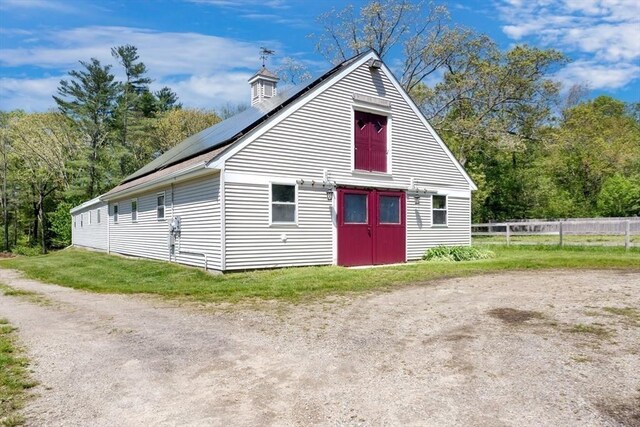78 Daniels St, Franklin, MA 02038 - view of outdoor structure featuring solar panels and fence