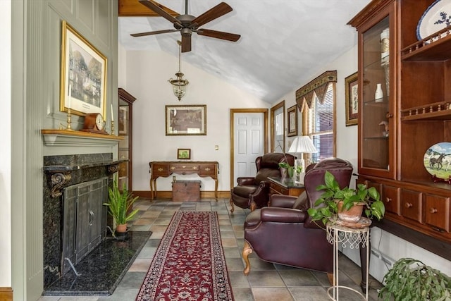 78 Daniels St, Franklin, MA 02038 - living area with a premium fireplace, ceiling fan, vaulted ceiling, and baseboards