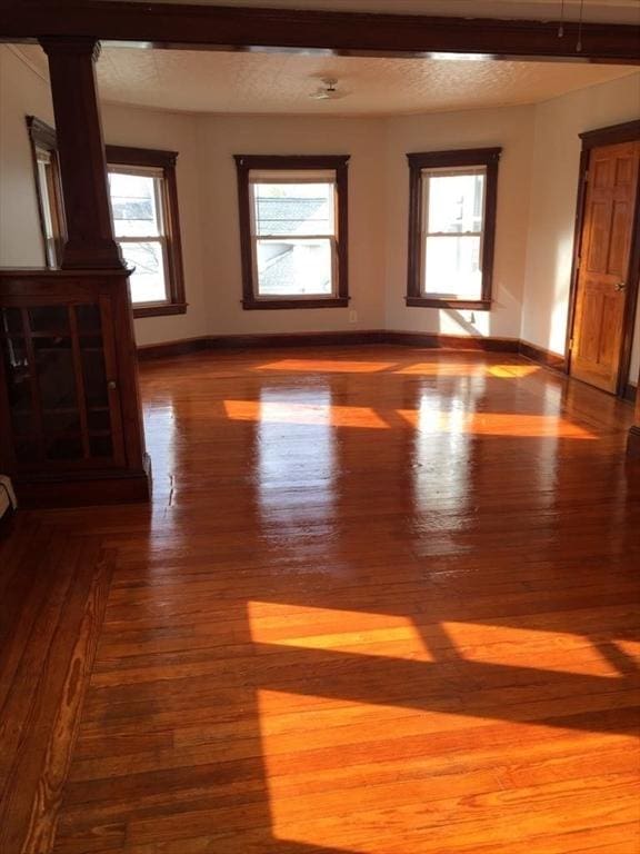 13 Elm St, Webster, MA 01550 - unfurnished room with dark wood-style flooring and plenty of natural light