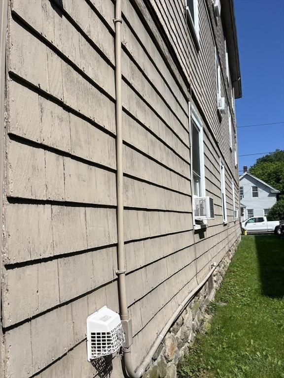 13 Elm St, Webster, MA 01550 - view of side of property featuring cooling unit and a yard