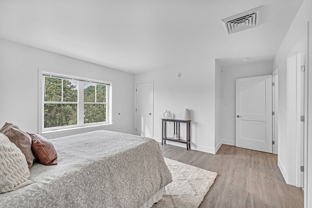 bedroom with light hardwood / wood-style flooring