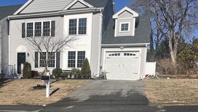 view of front of property with a garage