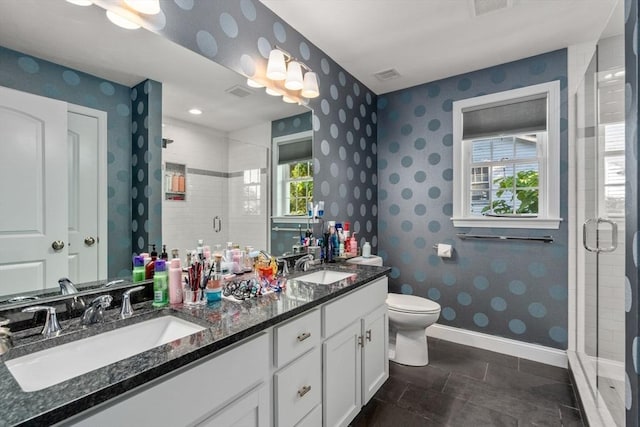 bathroom with vanity, toilet, and walk in shower