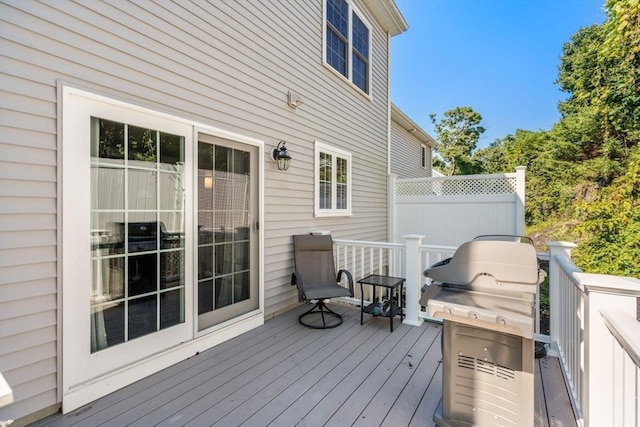 wooden deck featuring area for grilling