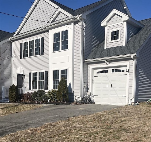 view of front of property featuring a garage