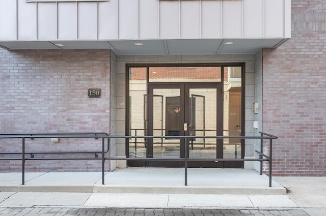 property entrance with brick siding