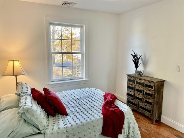 215 High St Unit 18, Taunton, MA 02780 - bedroom featuring baseboards, wood finished floors, and visible vents