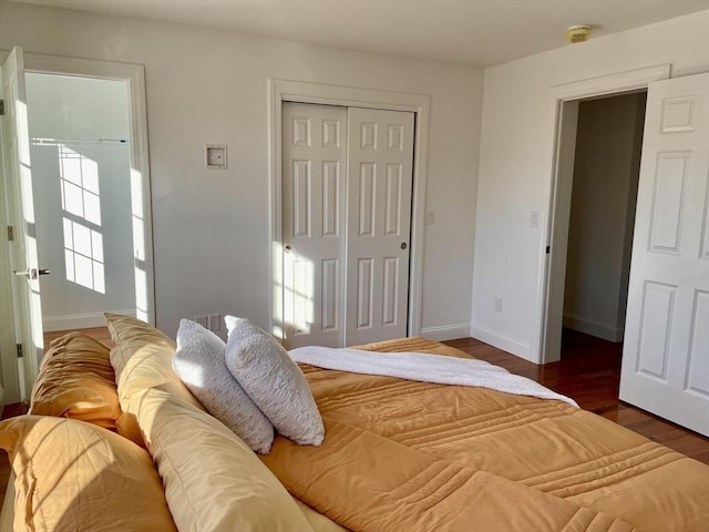 215 High St Unit 18, Taunton, MA 02780 - bedroom with wood finished floors, a closet, and baseboards