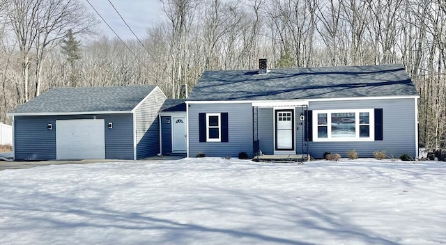 ranch-style home with a garage, a shingled roof, and a chimney