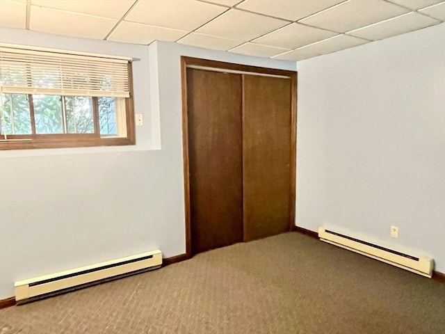 15 Old County Rd, Holland, MA 01521 - unfurnished bedroom featuring a closet, carpet floors, a baseboard heating unit, and a drop ceiling
