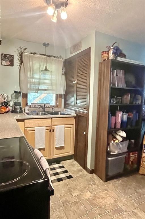 15 Old County Rd, Holland, MA 01521 - kitchen with light brown cabinetry, a sink, a textured ceiling, a ceiling fan, and black / electric stove