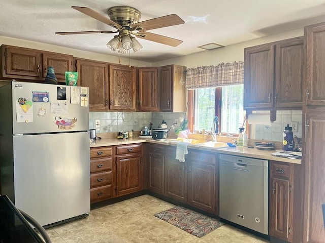 15 Old County Rd, Holland, MA 01521 - kitchen featuring ceiling fan, light countertops, freestanding refrigerator, backsplash, and stainless steel dishwasher