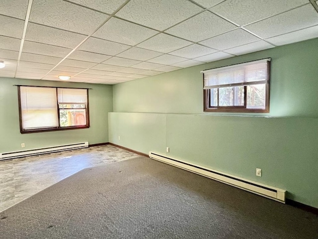15 Old County Rd, Holland, MA 01521 - spare room featuring a baseboard heating unit, a drop ceiling, and a wealth of natural light