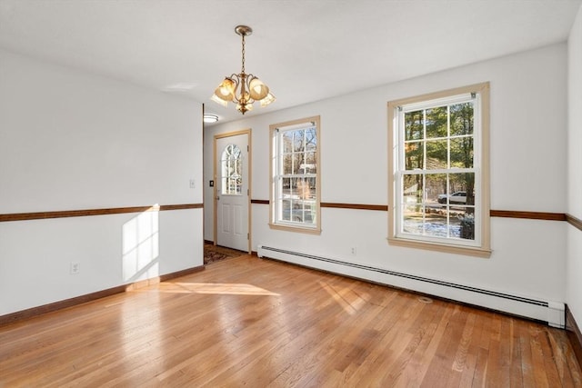 209 Pleasant, Millis, MA 02054 - foyer featuring a baseboard radiator, a chandelier, hardwood / wood-style floors, and baseboards