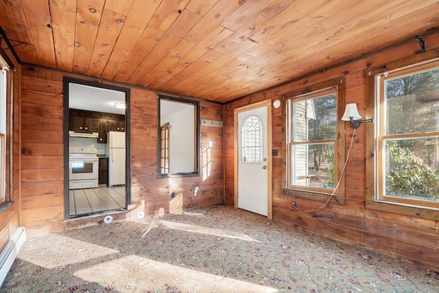 209 Pleasant, Millis, MA 02054 - foyer featuring wooden walls and a baseboard heating unit