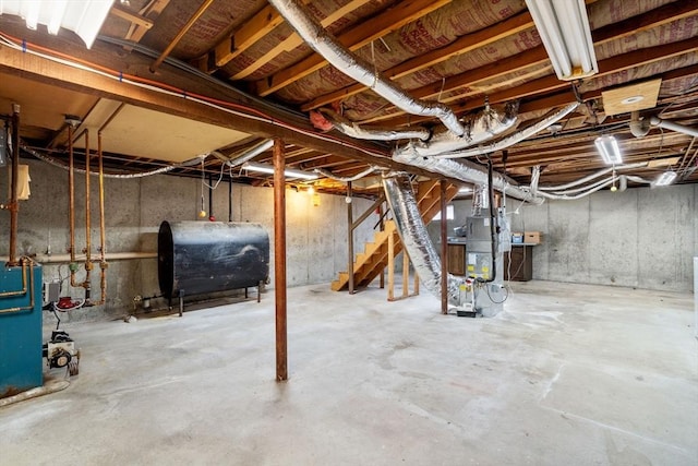 209 Pleasant, Millis, MA 02054 - unfinished basement with oil tank, stairs, and water heater