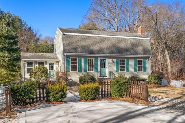 209 Pleasant, Millis, MA 02054 - colonial inspired home featuring a shingled roof, a gambrel roof, fence, and a chimney