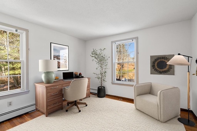 209 Pleasant, Millis, MA 02054 - office featuring a baseboard radiator, plenty of natural light, and wood finished floors