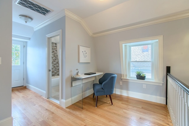 office featuring ornamental molding, lofted ceiling, and light wood-type flooring