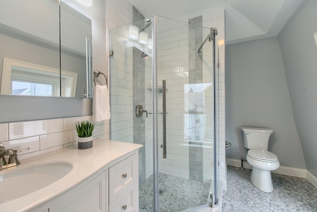 bathroom with a shower with door, backsplash, toilet, vanity, and tile patterned floors