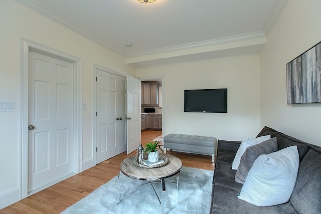 living room featuring ornamental molding and hardwood / wood-style floors