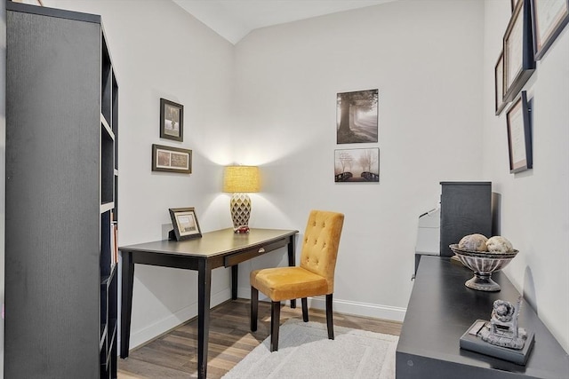 office area with lofted ceiling, light wood-style floors, and baseboards