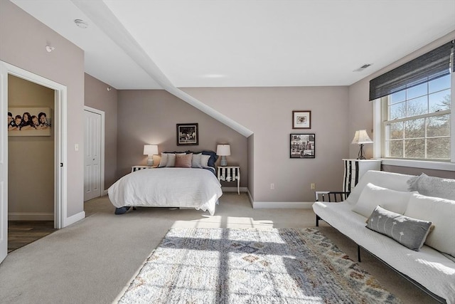 carpeted bedroom with baseboards and visible vents